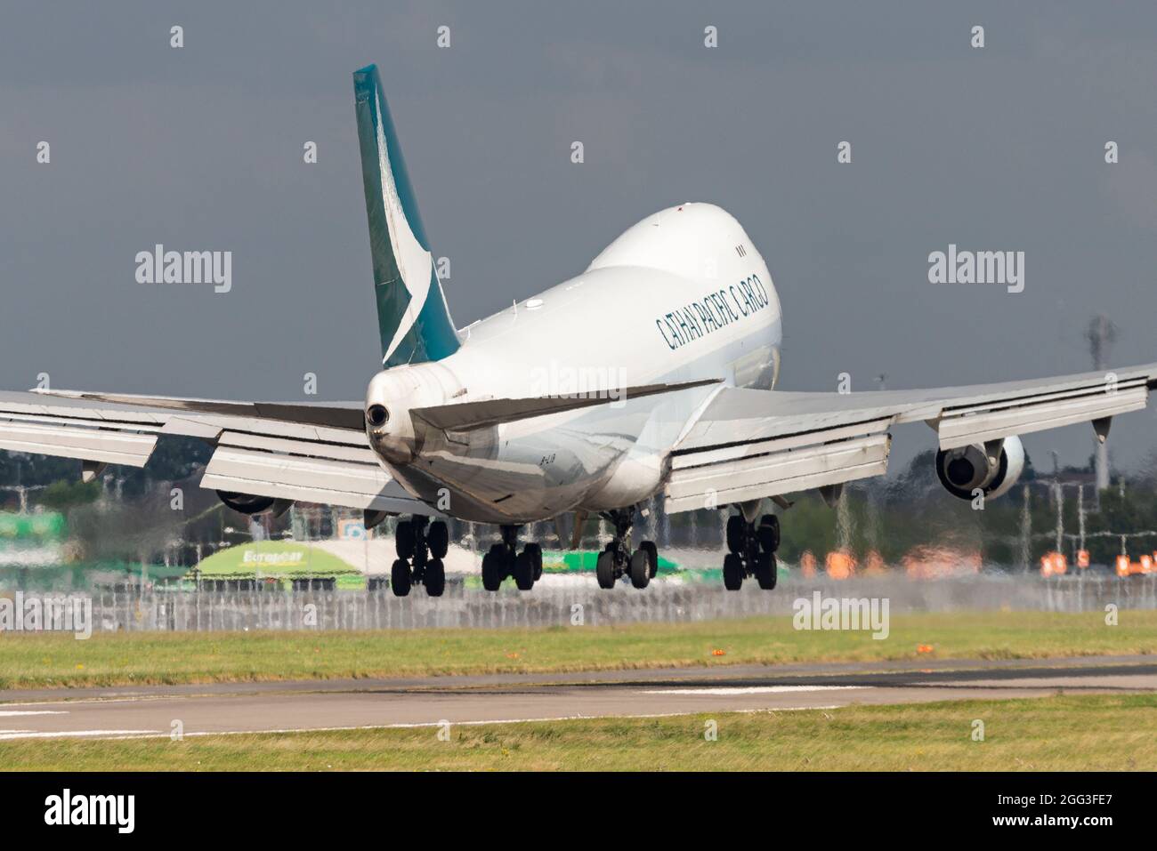 Cathay Pacific Cargo Boeing 747 freighter Jumbo Jet airliner jet plane landing at London Heathrow Airport, UK, about to touch down on runway Stock Photo