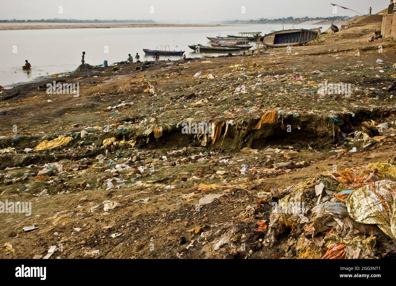 Waste is visible on the banks of the River Ganges in Varanasi, India, due to an historic low water level because of drought. Stock Photo