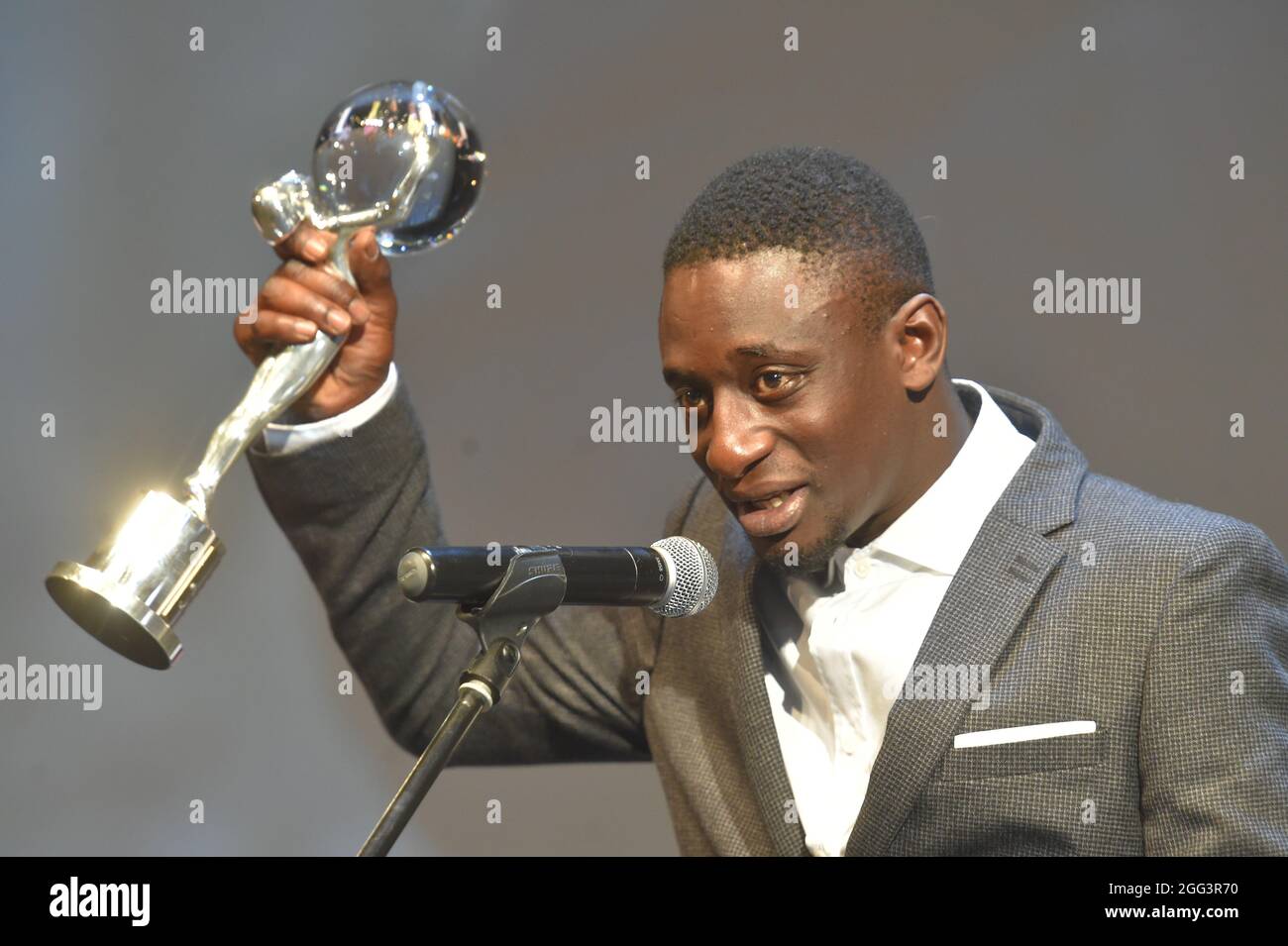 Karlovy Vary, Czech Republic. 28th Aug, 2021. French actor Ibrahim Koma  speaks after he received Crystal Globe award for best actor's performance  (film As Far as I Can Walk) during award-giving closing