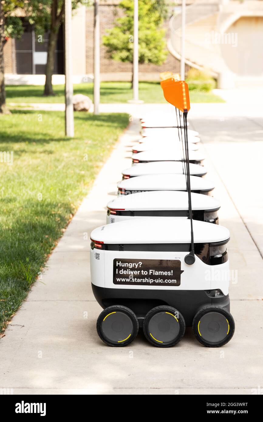 A line of Starship food delivery robots waiting to be put into action on the campus of the University of Illinois in Chicago, United States. Stock Photo