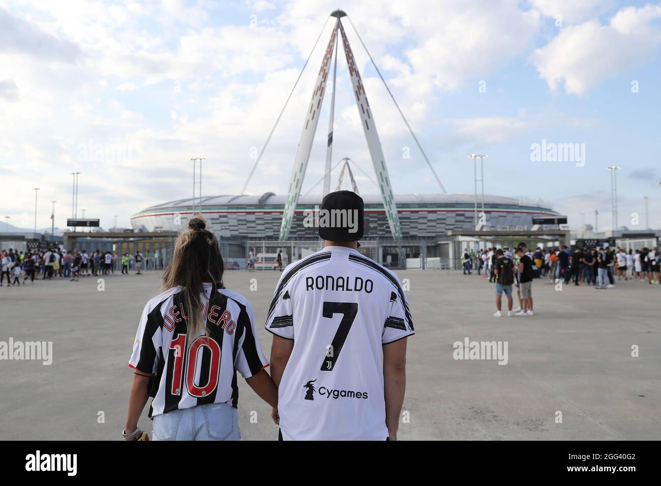 Turin, Italy, 28th August 2021. Juventus fans approach the stadium wearing jerseys bearing the names of Alessandro Del Piero and Cristiano Ronaldo prior to the Serie A match at Allianz Stadium, Turin. Picture credit should read: Jonathan Moscrop / Sportimage Stock Photo