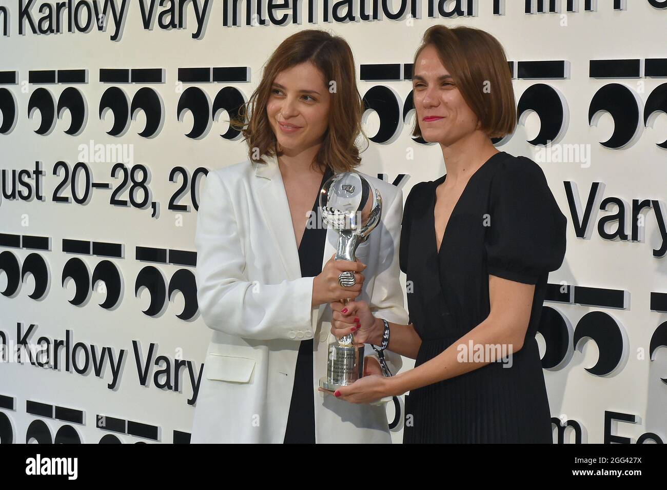 Karlovy Vary, Czech Republic. 28th Aug, 2021. Film director Dina Duma, left, and producer Marija Dimitrova pose after they received Crystal Globe award for film Sisterhood during award-giving closing ceremony of 55th Karlovy International Film Festival (KVIFF), on August 28, 2021, in Karlovy Vary, Czech Republic. Credit: Slavomir Kubes/CTK Photo/Alamy Live News Stock Photo