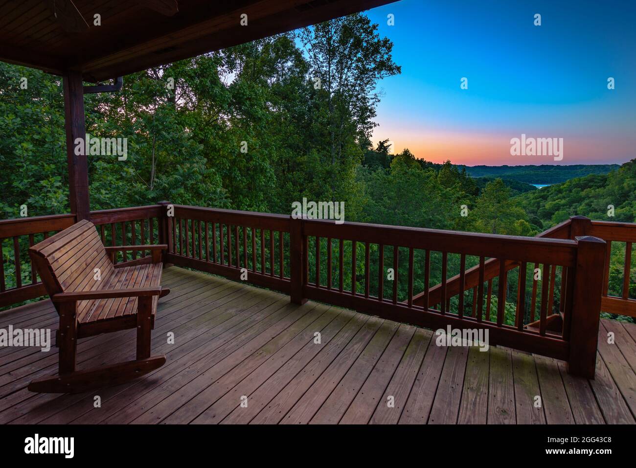 Balcony Rocking Bench Rocking bench on balcony in the hills at sunset Stock Photo - Alamy