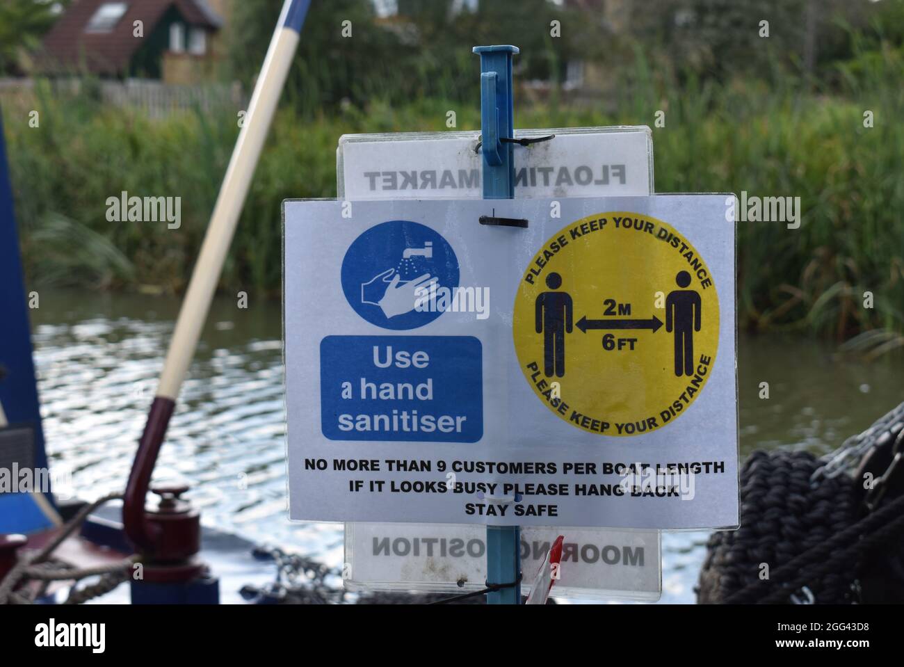 Social distancing sign at the floating market on the Grand Union Canal in Milton Keynes. Stock Photo
