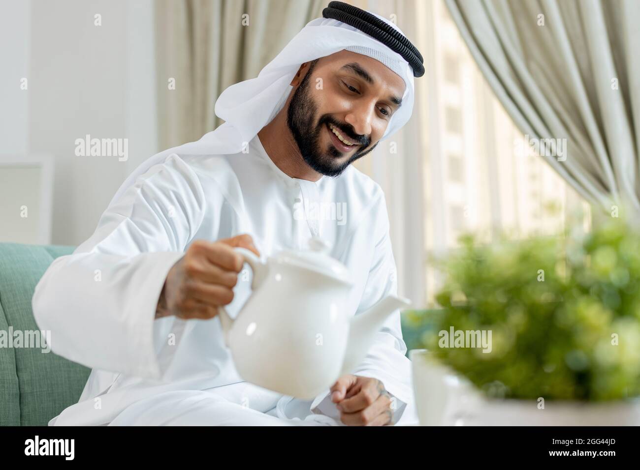 Young Arab Emirati Entrepreneur working from home Stock Photo