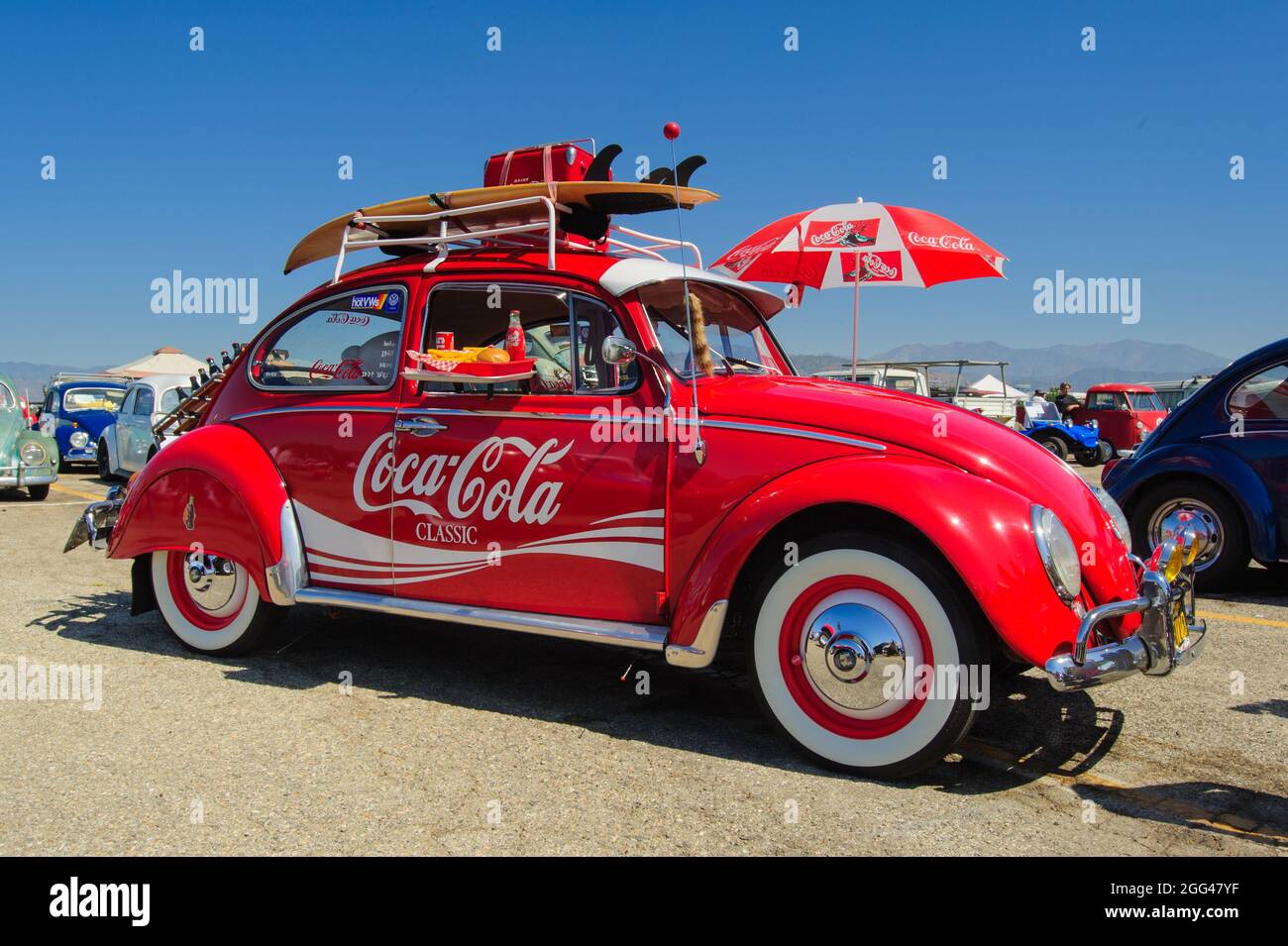 Pomona, USA - June 1, 2014: Red Coca-Cola Classic-branded VW Beetle at Pomona Classic Car Show and Sale near Los Angeles. Stock Photo