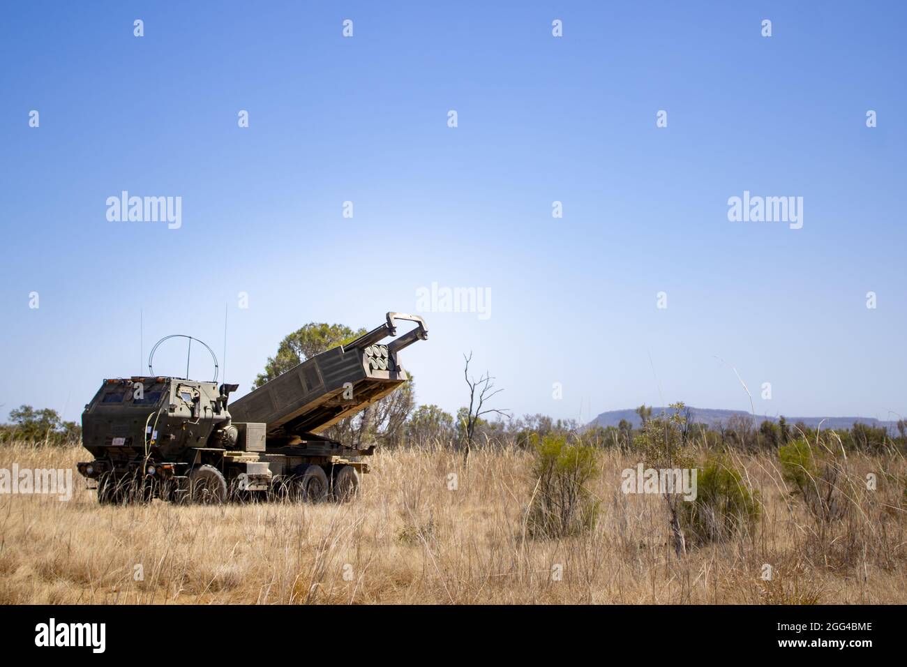 A High Mobility Artillery Rocket System assigned to Marine Rotational Force - Darwin aims it’s launcher while conducting an emergency fire mission rehearsal during Exercise Koolendong at Bradshaw Field Training Area, NT, Australia, Aug. 25, 2021. An emergency fire mission consists of HIMARS receiving a target location, convoying to a firing point, firing a payload and retrograding to a safe location. Exercise Koolendong validates MRF-D’s and the Australian Defence Force’s ability to conduct expeditionary advanced base operations with combined innovative capabilities; and through their shared c Stock Photo
