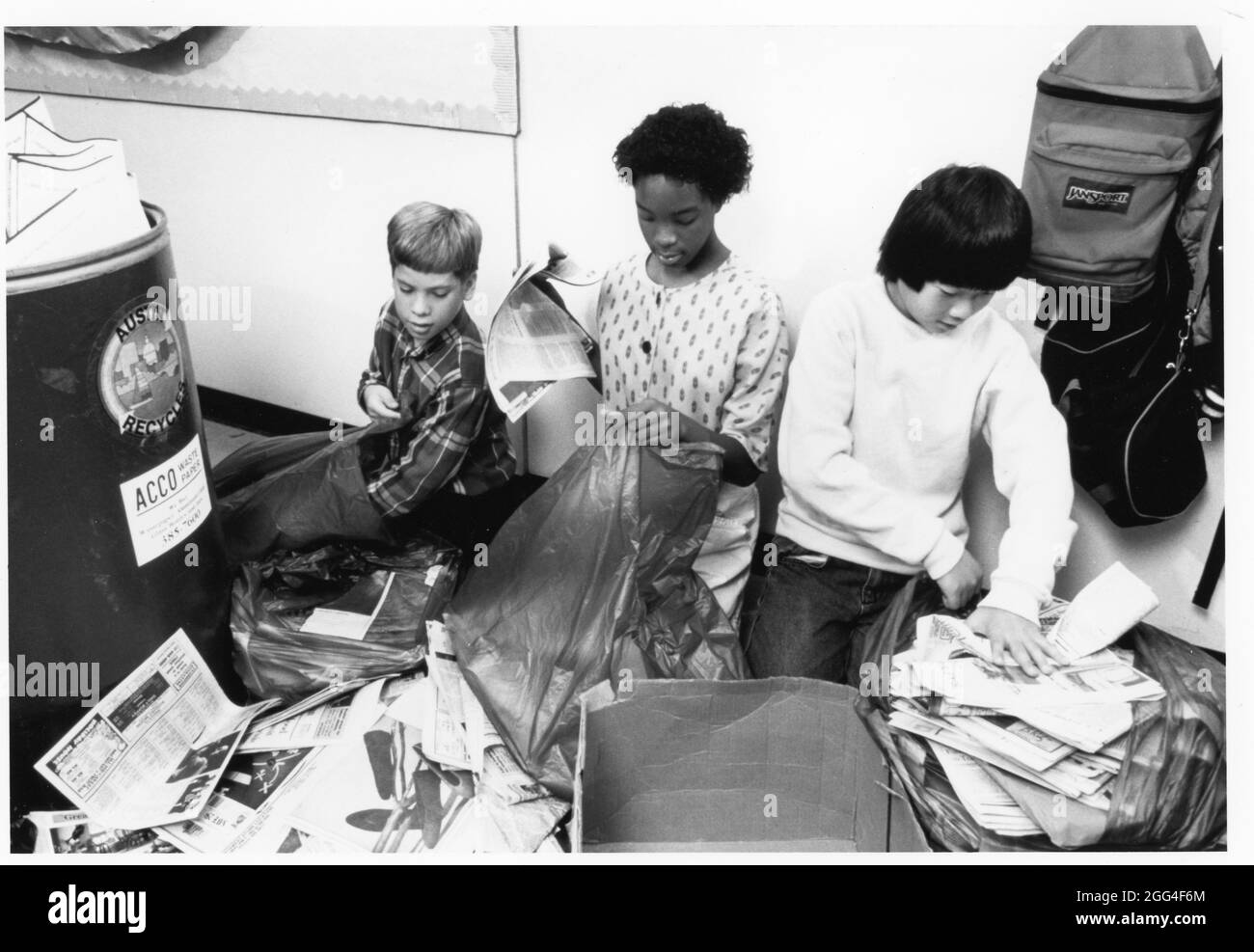 Austin Texas USA, circa 1988: Sixth grade students sort newspapers and ...