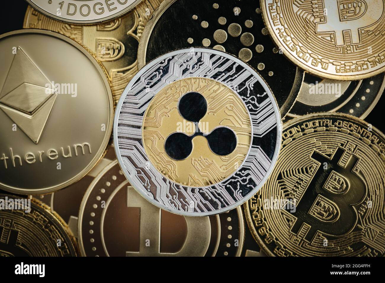 Ripple XRP cryptocurrency, physical coin close-up, on top of other  cryptocurrency coins Stock Photo - Alamy