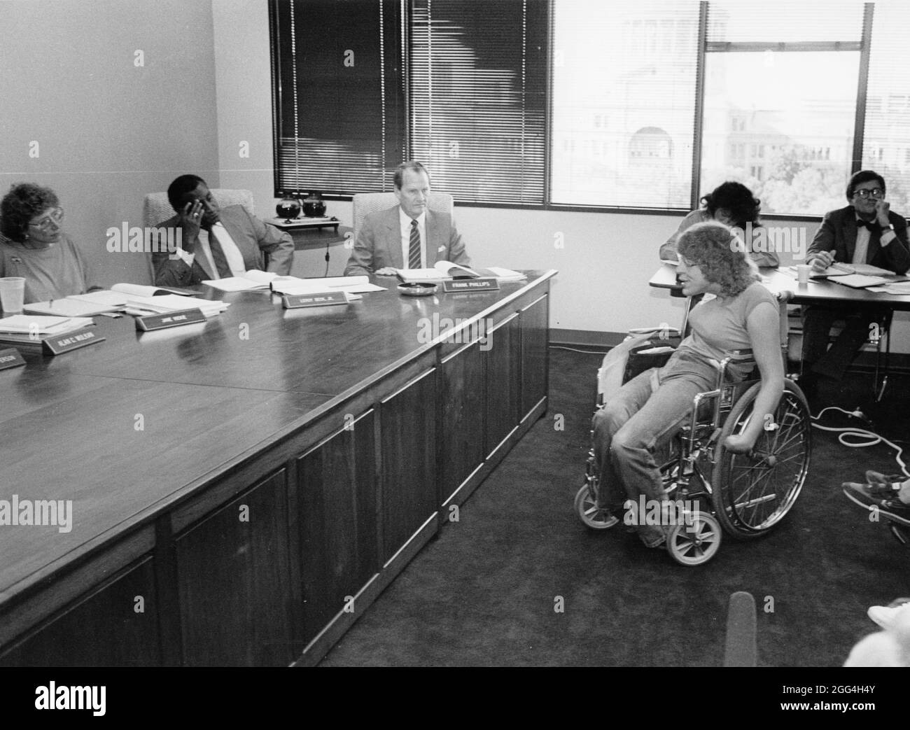 © 1990 Disabled rights advocates before the city transportation board, Austin, TX Stock Photo