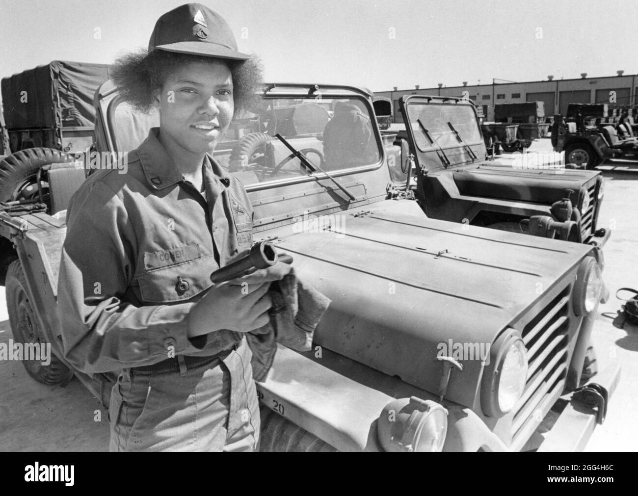 Fort Hood Texas USA, 1990: Female Army Jeep mechanic at U.S. Army post in Central Texas. ©Bob Daemmrich Stock Photo