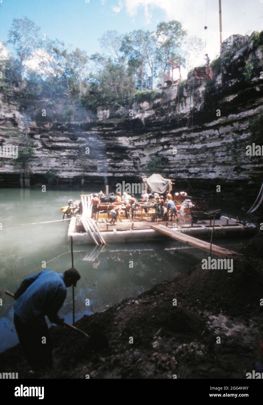 View of the archeological team at the Sacred Cenote of Chichen Itza in 1967 when an attempt was made to drain the cenote and exhume Mayan artifacts under the leadership of Román Piña Chán. Stock Photo