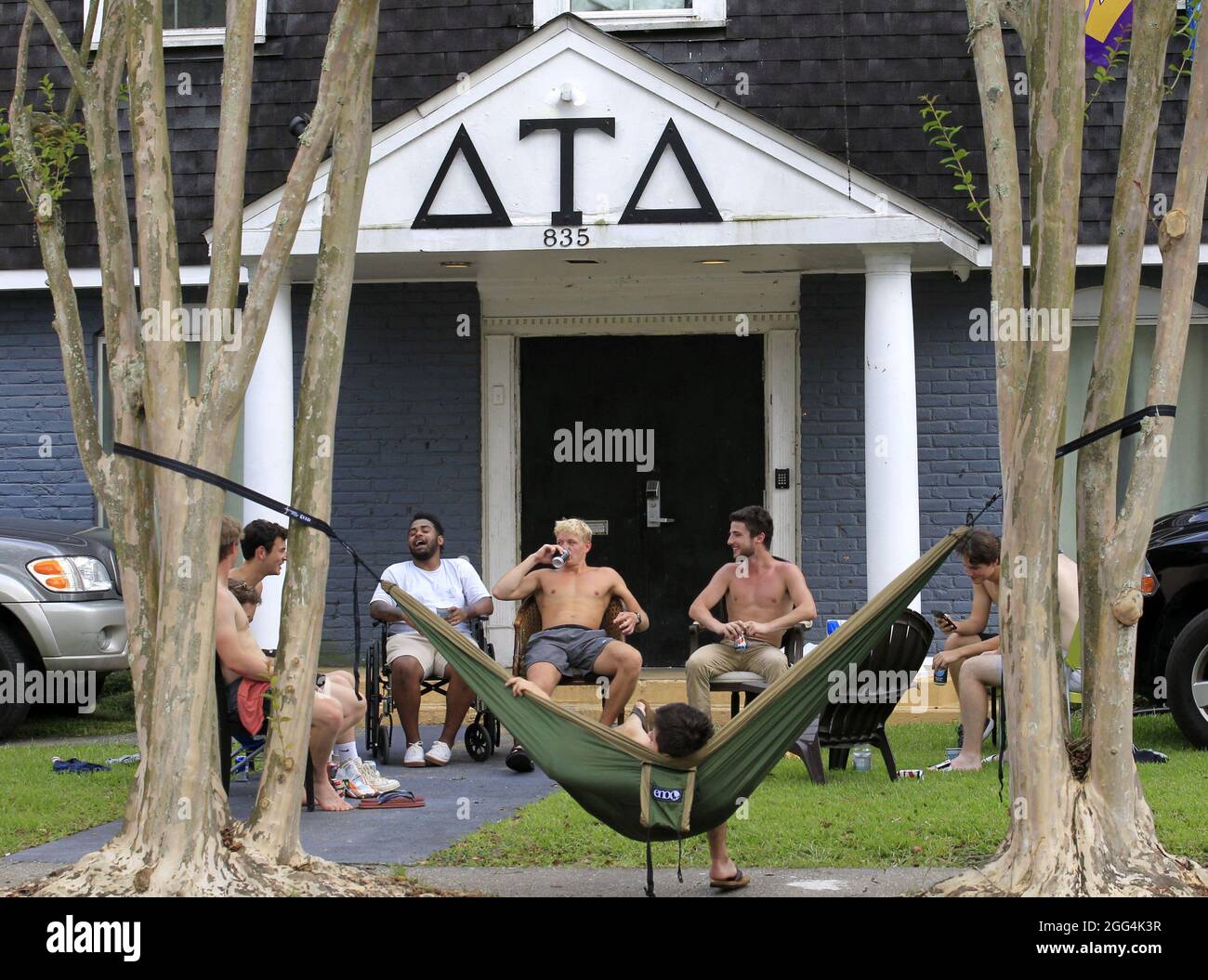 New Orleans, United States. 28th Aug, 2021. Students sit outside a Tulane University frat house as Hurricane Ida approaches the city of New Orleans on Saturday, August 28, 2021. Photo by AJ Sisco/UPI Credit: UPI/Alamy Live News Stock Photo