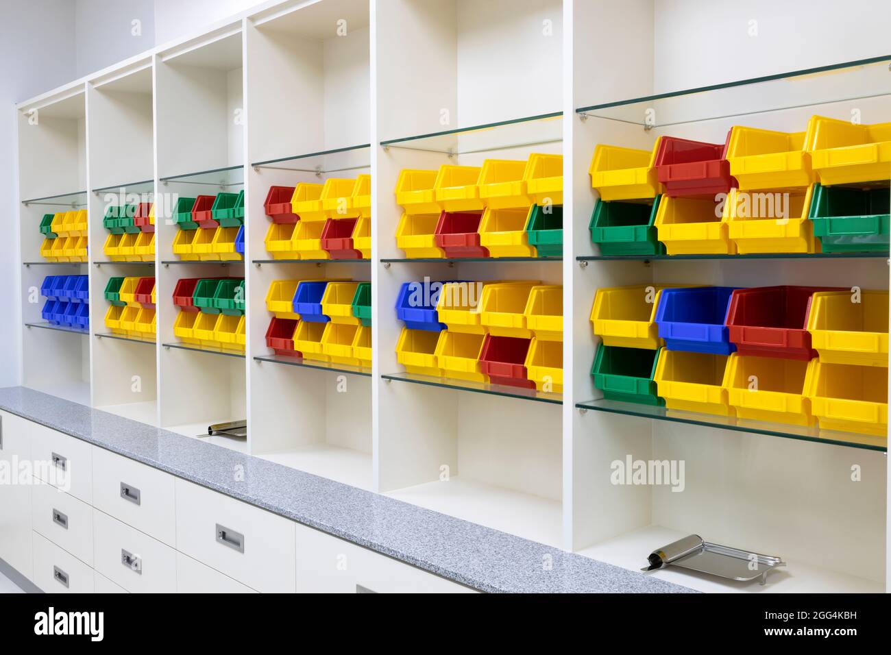 Modern pharmacy shelves with multi color boxes for storage Stock Photo