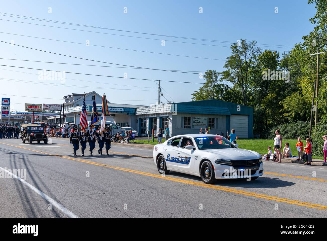 Elizabethtown, KY, USA, 28th Aug 2021, an Elizabethtown Police car leads the U.S. Army Color Guard down Dixie Avenue during the Hearthland Homecoming Parade 2021, Credit: Brian Koellish/Alamy Live News Stock Photo