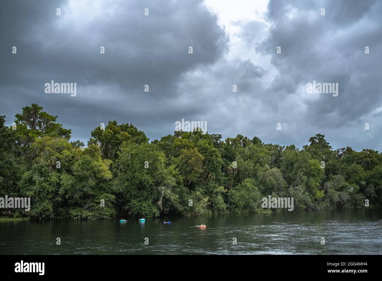 Tubers float down the Rainbow River. Marion County, Dunnellon, Florida. In the area of KP Hole of Rainbow Springs. A scenic outstanding Florida waterw Stock Photo