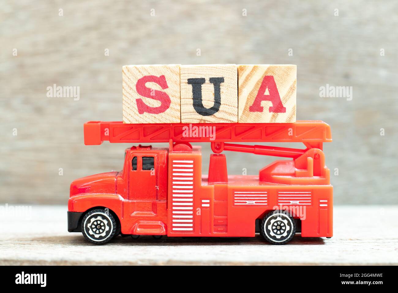 Fire ladder truck hold letter block in word SUA (Abbreviation of Single