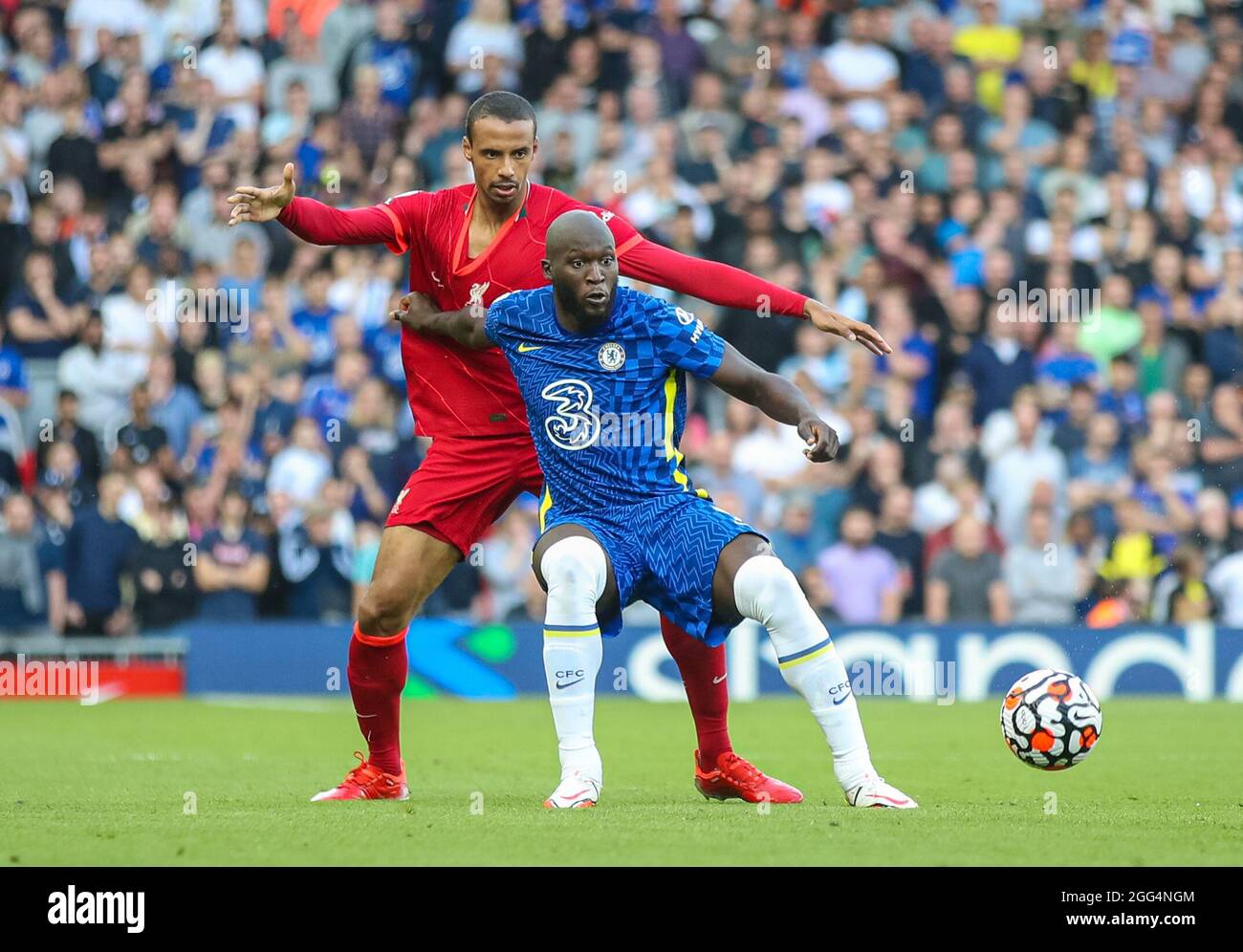 Liverpool. 29th Aug, 2021. Chelsea's Romelu Lukaku (R) vies with Liverpool's Joel Matip during the Premier League match between Liverpool and Chelsea at Anfield in Liverpool, Britain, on Aug. 28, 2021. Credit: Xinhua/Alamy Live News Stock Photo