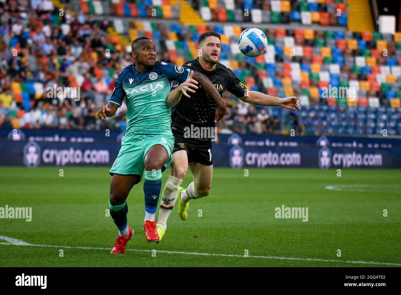 Udine, Italy. 27th Aug, 2021. Venezia's Thomas Henry (R) and Udinese's  Samir Caetano de Souza Santos (L) fight for the ball during Udinese Calcio  vs Venezia FC, Italian football Serie A match