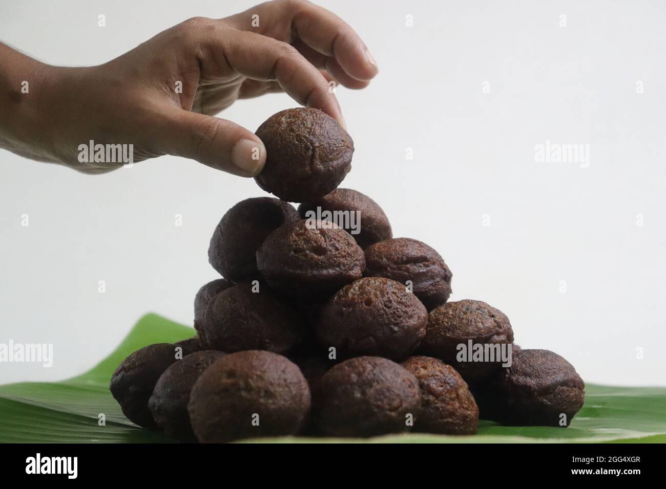 Rice fritters made with a batter of rice flour, banana, jaggery and