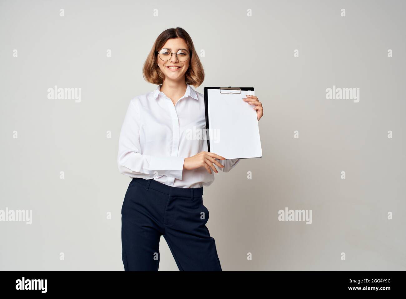 cheerful business woman with folder in hands documents office light ...