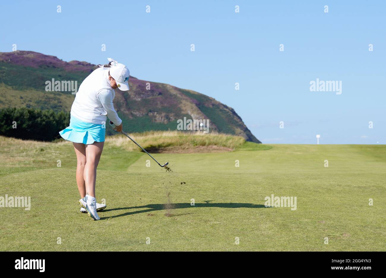 Team GB&I's Charlotte Heath plays her second shot the the second green during the 2021 Curtis Cup Day 3 - Singles at Conwy Golf Club, Conwy, Wales on Stock Photo