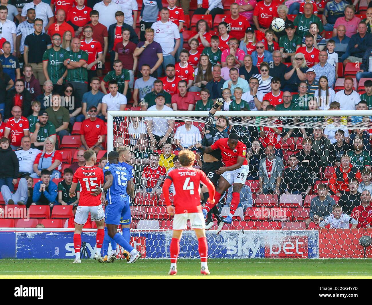 Matija Šarkic #13 of Birmingham City punches the ball clear of Victor Adeboyejo #29 of Barnsley Stock Photo