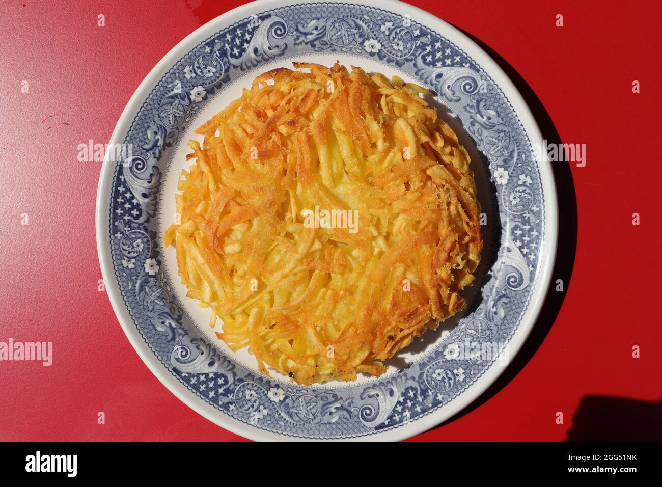 a delicious Appenzeller rösti filled with cheese Stock Photo - Alamy
