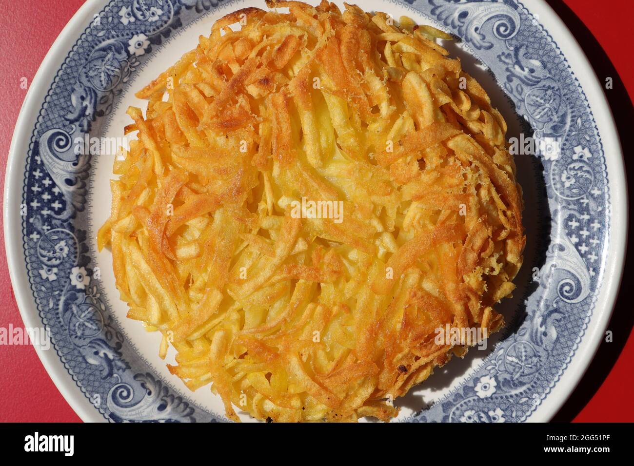 a delicious Appenzeller rösti filled with cheese Stock Photo - Alamy