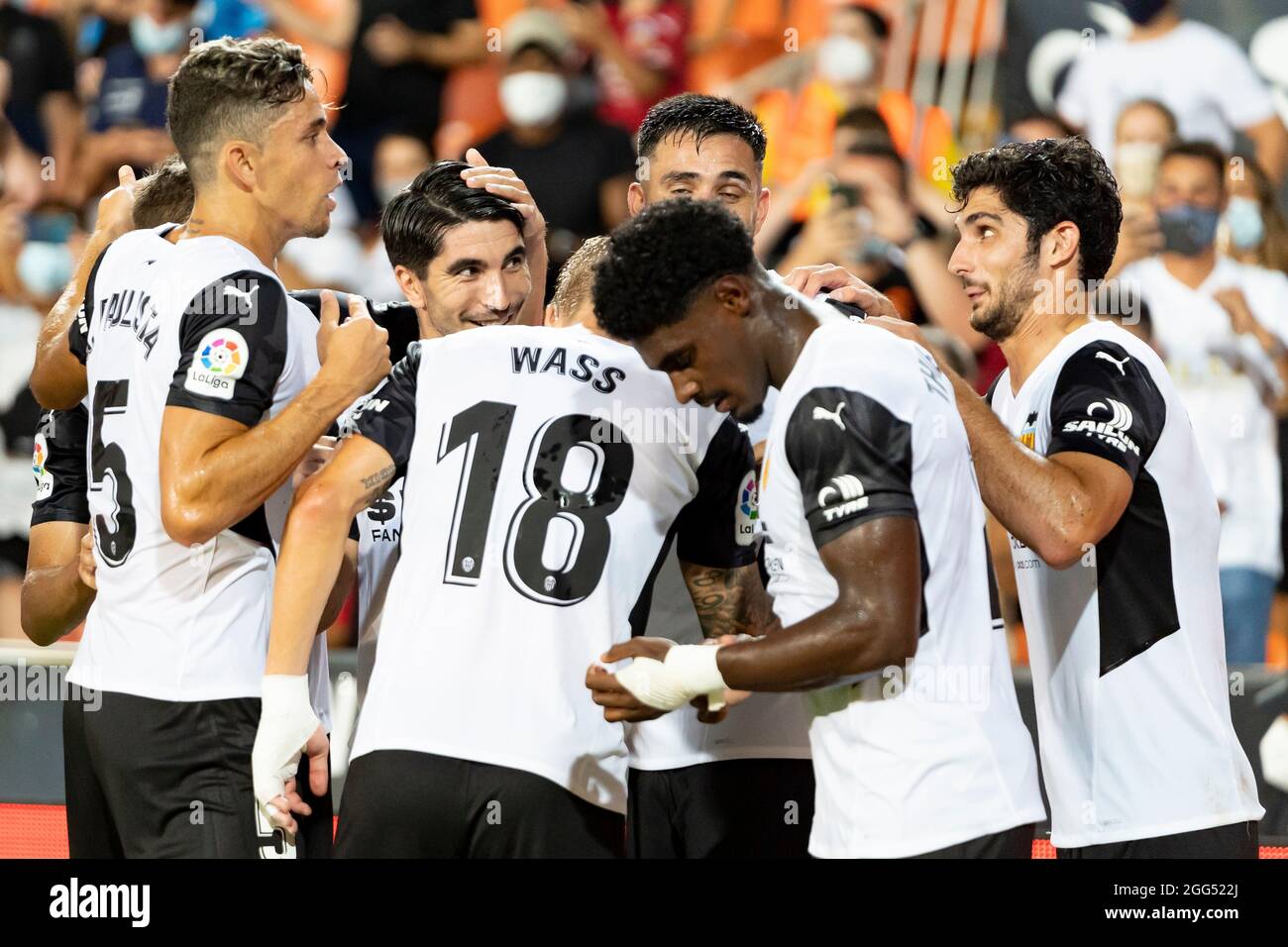 Valencia, Spain. 27th Aug, 2021. Valencia CF players celebrate after scoring a goal during the Spanish La Liga football match between Valencia CF and Deportivo Alavés at Mestalla Stadium.Final score; Valencia CF