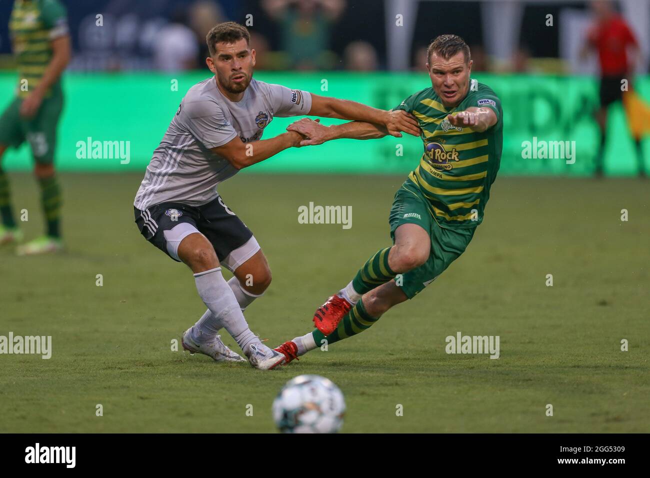 St. Petersburg, FL USA;  Tampa Bay Rowdies midfielder Lewis Hilton (4) is held by Charlotte Independence midfielder Marcelo Palomino (8) while scrambl Stock Photo
