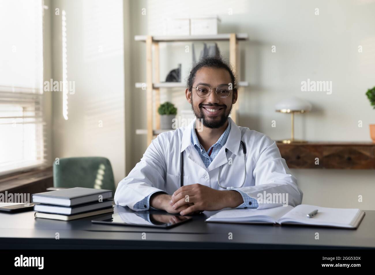 Portrait of smiling 30s young african american doctor. Stock Photo