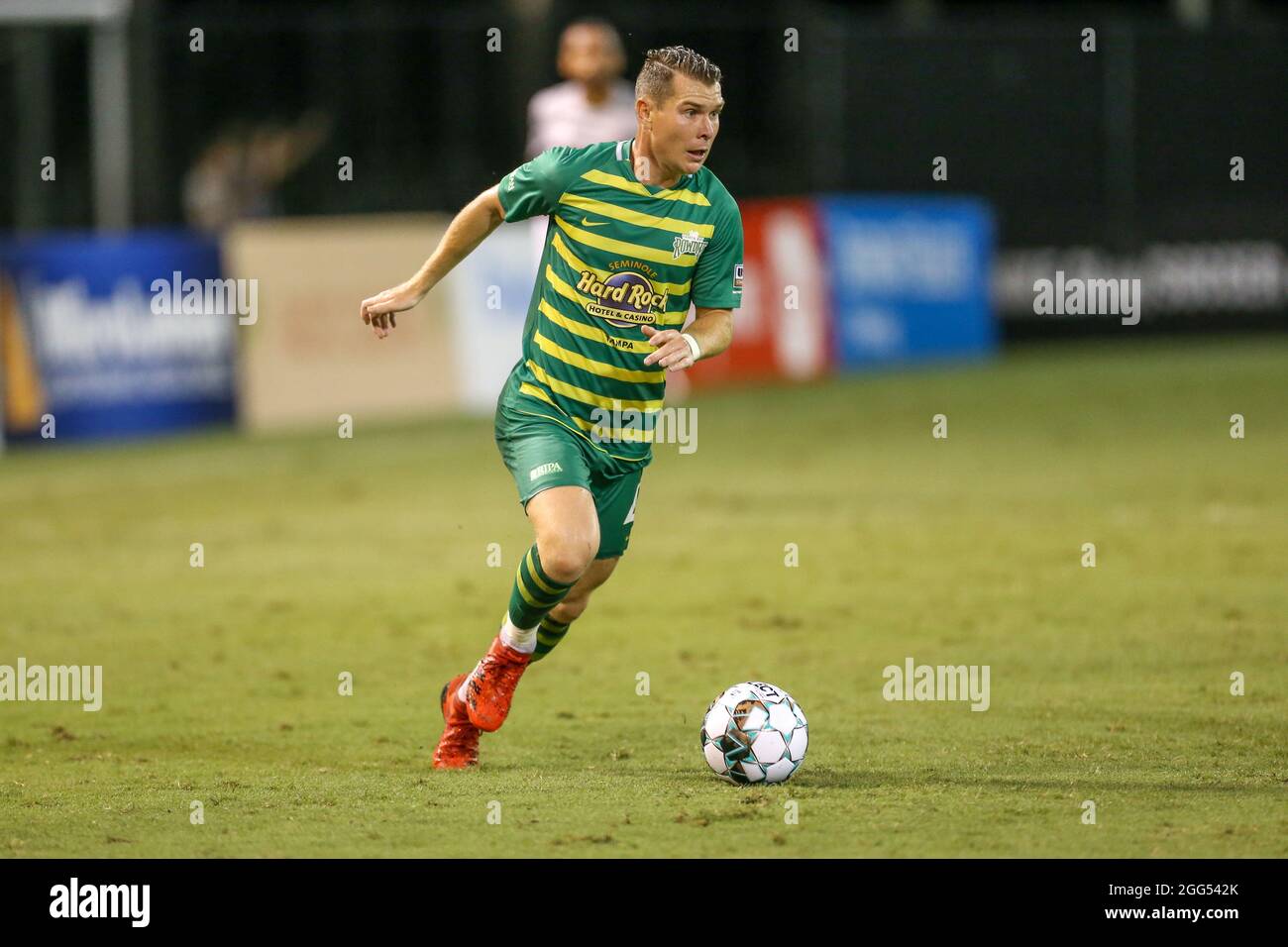 St. Petersburg, FL USA;  Tampa Bay Rowdies midfielder Lewis Hilton (4) dribbles the ball up the pitch during a USL soccer game against the Charlotte I Stock Photo