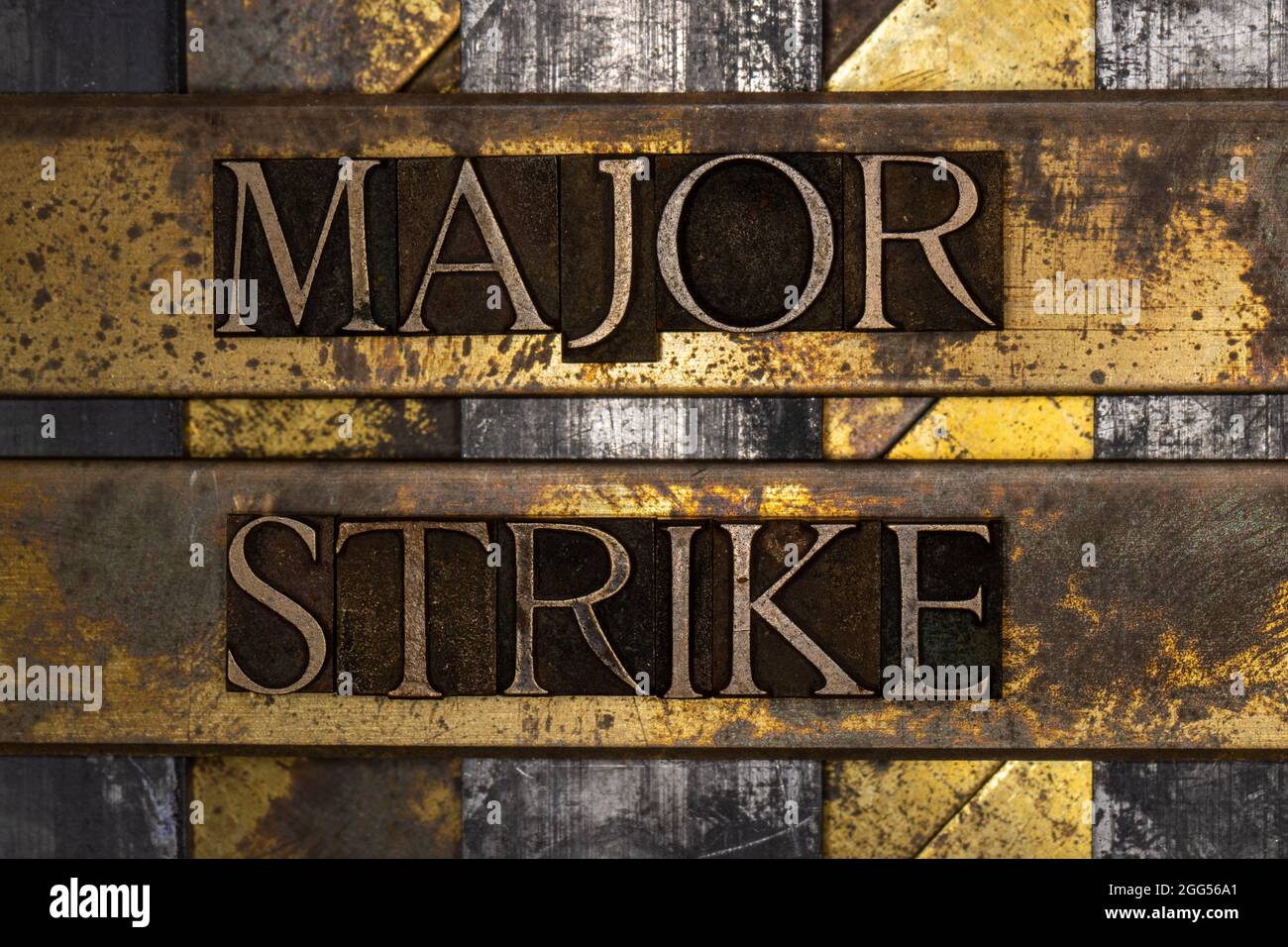 Major Strike text message on textured grunge copper and vintage gold ...