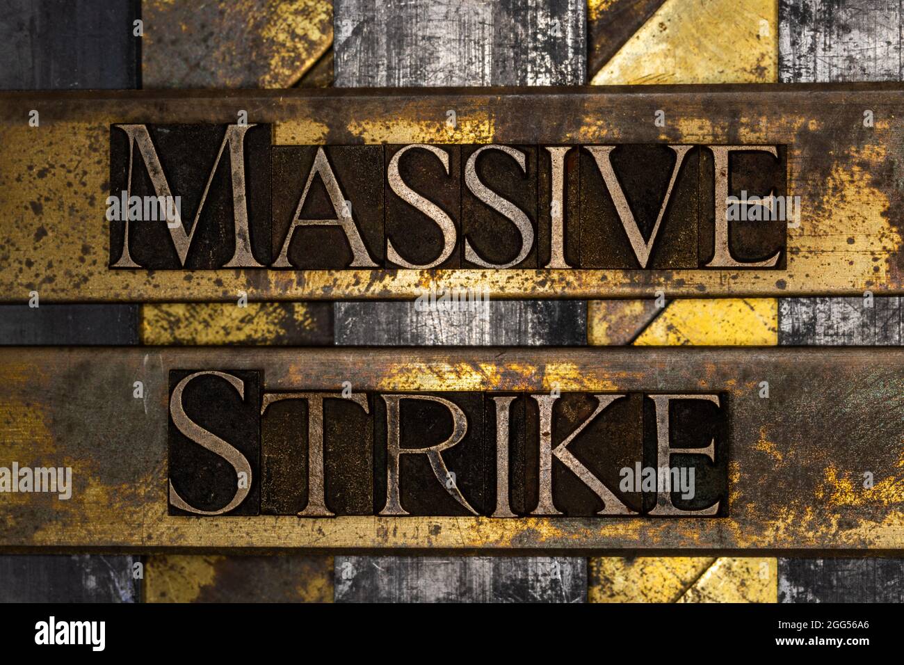 Massive Strike text message on textured grunge copper and vintage gold ...