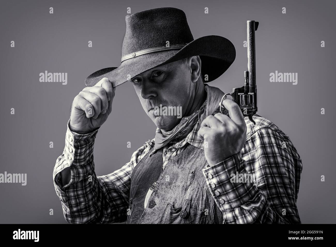American cowboy. Cowboy wearing hat. Western life. Guy in cowboy hat.  American bandit in mask, western man with hat. Man wearing cowboy hat, gun.  West Stock Photo - Alamy