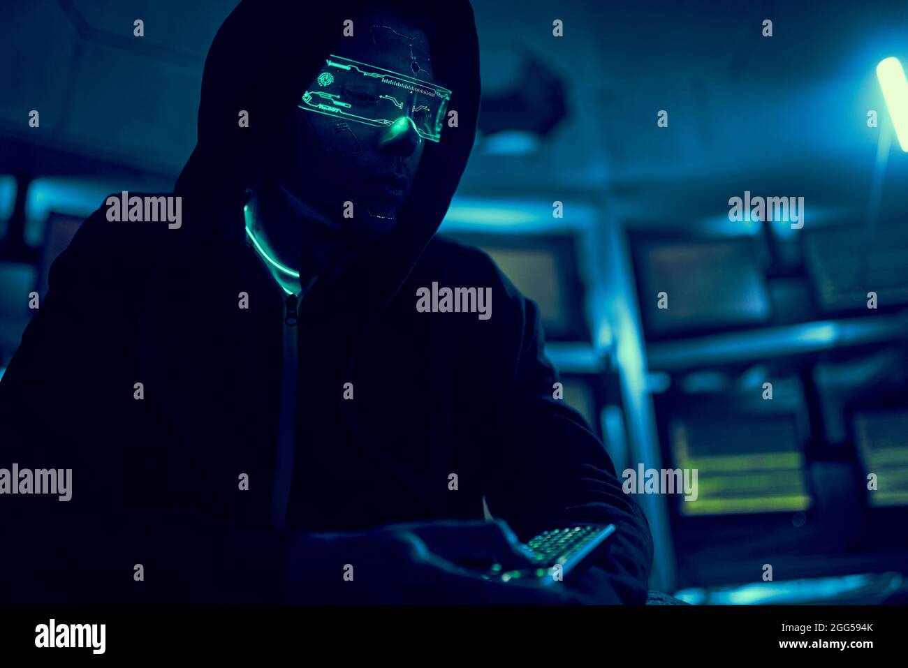 Cyber hacker breaks into databases to obtain information using a computer. Cybercrime and data security concept. Stock Photo
