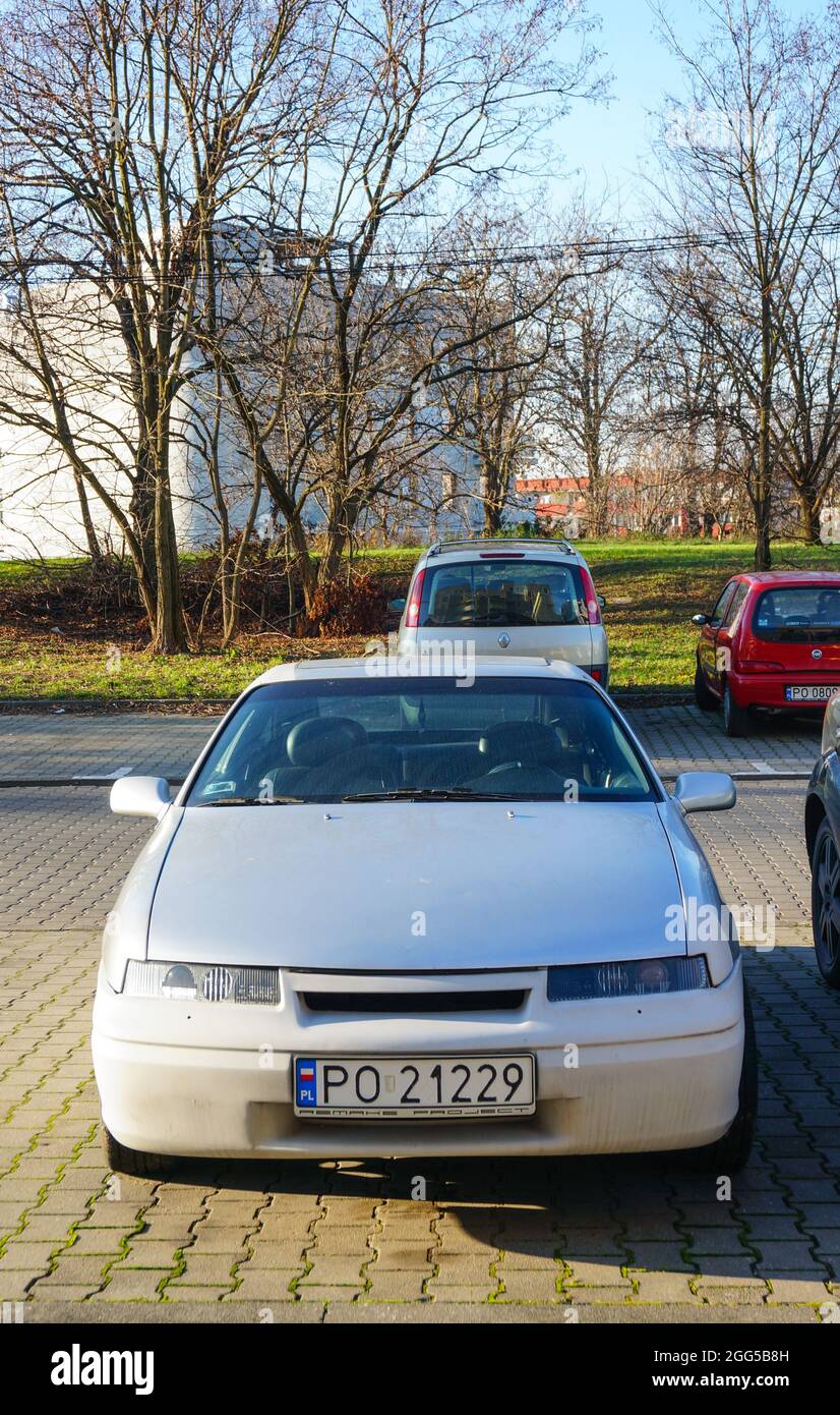 POZNAN, POLAND - Jan 28, 2016: A vertical shot of a parked old Opel Calibra car on a parking lot outdoors Stock Photo