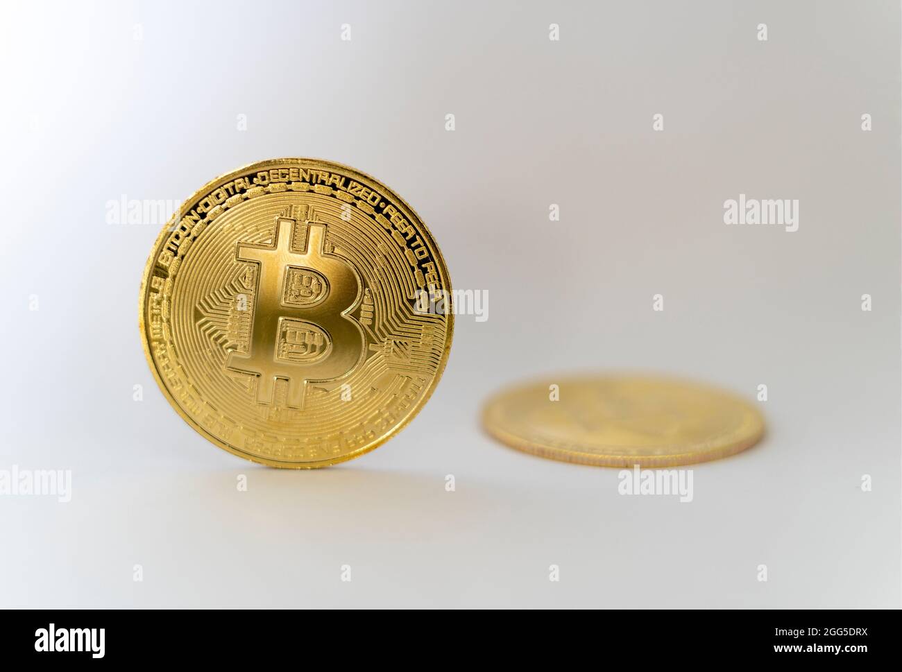 Bitcoin crypto currency holding. Gold coin with BTC symbol. Blockchain technology. Bitcoin Increase in price or crash. Investing in virtual assets. Stock Photo