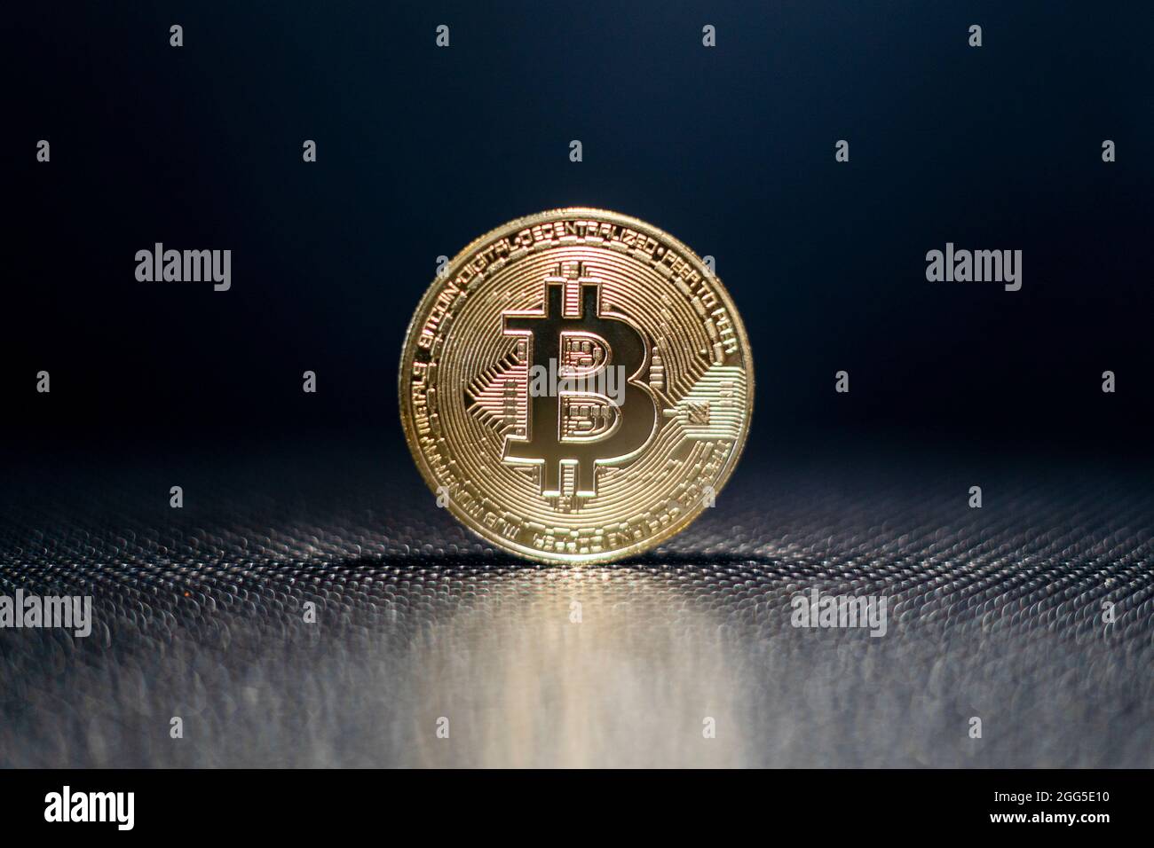 Bitcoin crypto currency holding. Gold coin with BTC symbol. Blockchain technology. Bitcoin Increase in price or crash. Investing in virtual assets. Stock Photo