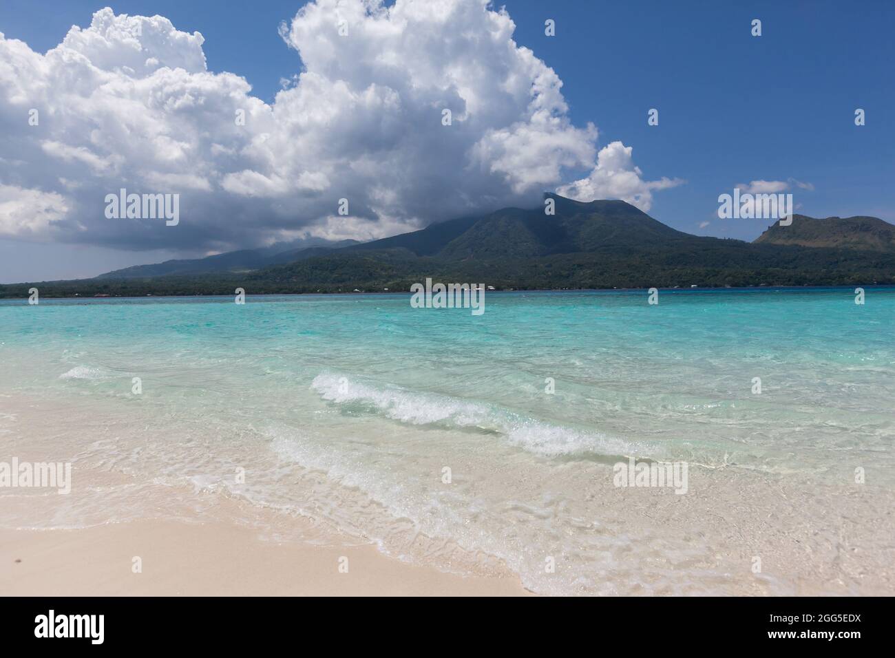 white sand beach sandbank with volcano view Philippines  Stock Photo