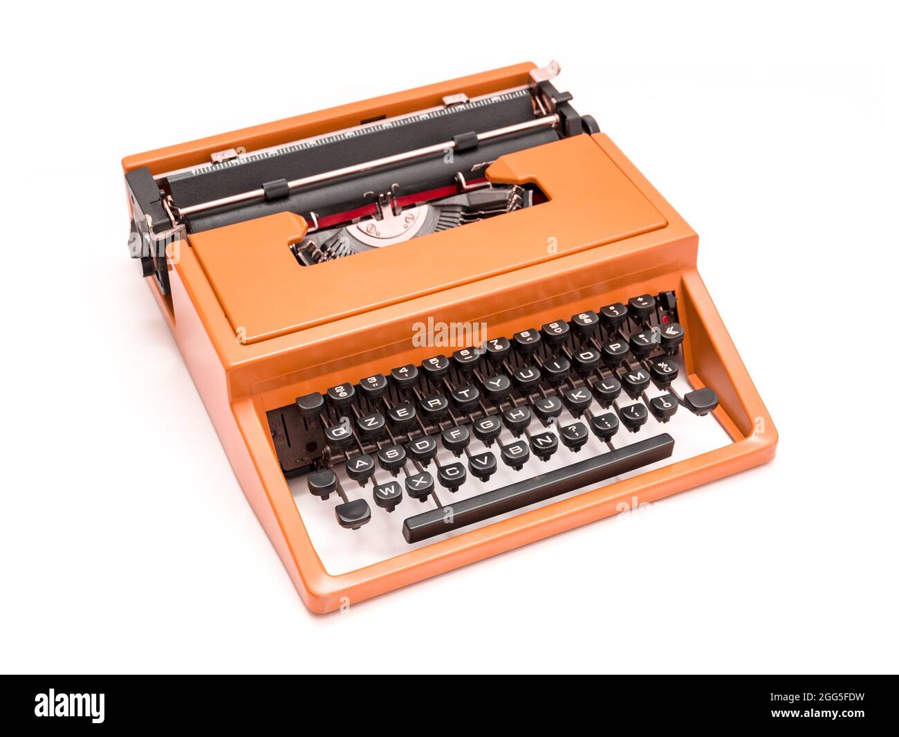 Studio photo of a vintage red typewriter on a white background Stock Photo