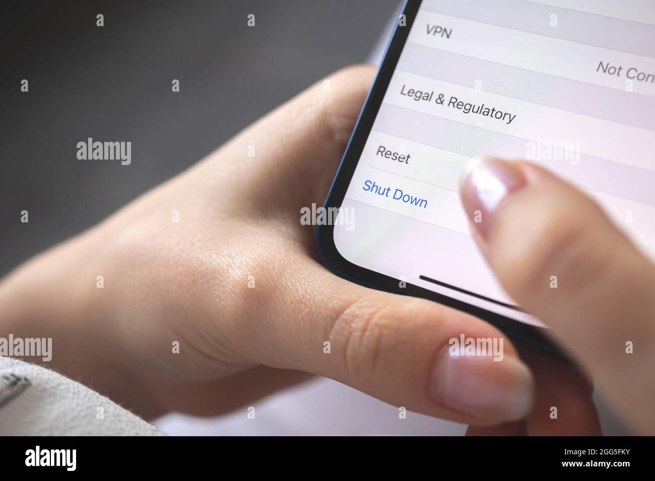 Person shut down the smartphone, mobile phone turn off concept photo