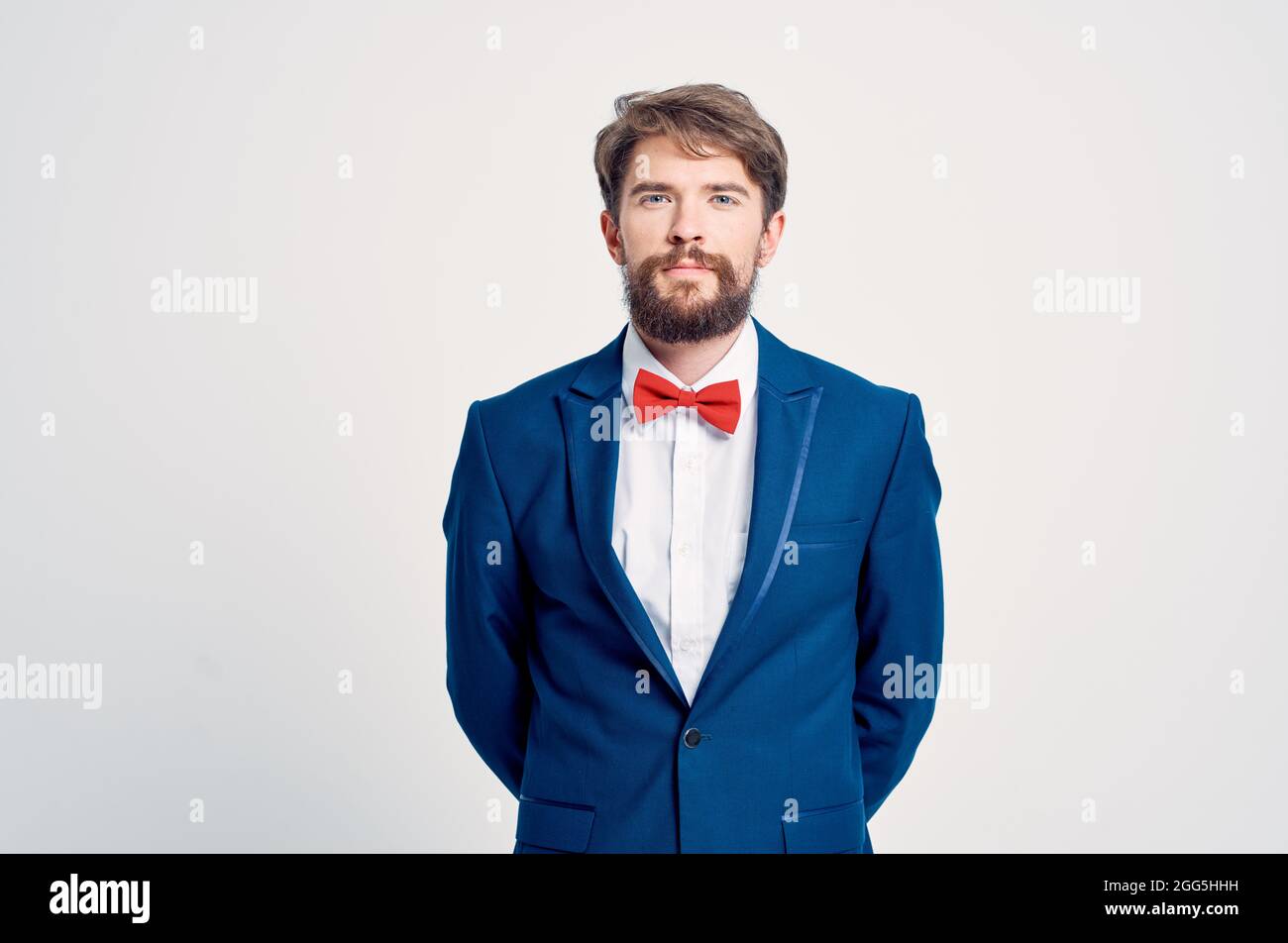 man in suit red bow tie posing Stock Photo - Alamy