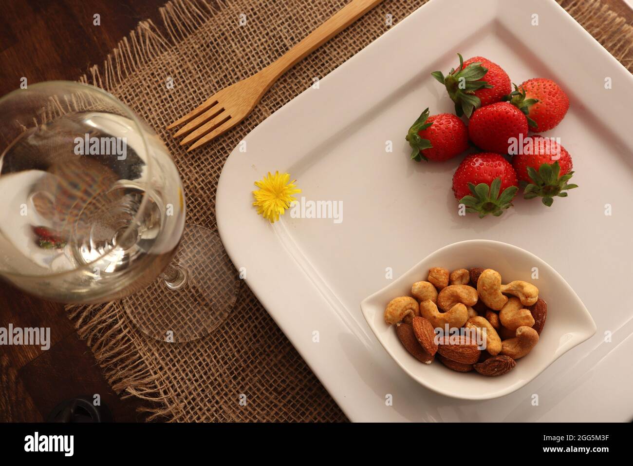 Mix nuts in bowls on wooden table. assorted nuts, pistachios, almonds, cashews, peanuts. diet and healthy eating concept Stock Photo