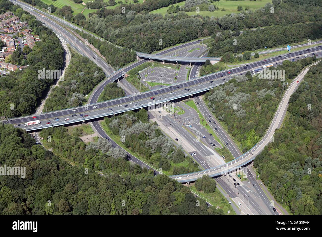 aerial view of the A580 Wardley Park & Ride facility at junction 14 of the M60 motorway where it meets the A580 road at Wardley, Swinton, Manchester Stock Photo