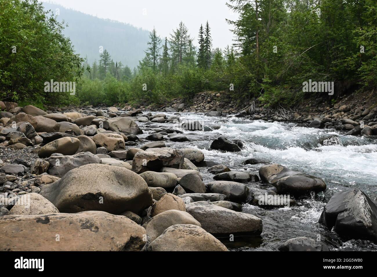 Putorana Plateau, a waterfall on the Grayling Stream. Mountain stream on a  cloudy day Stock Photo - Alamy