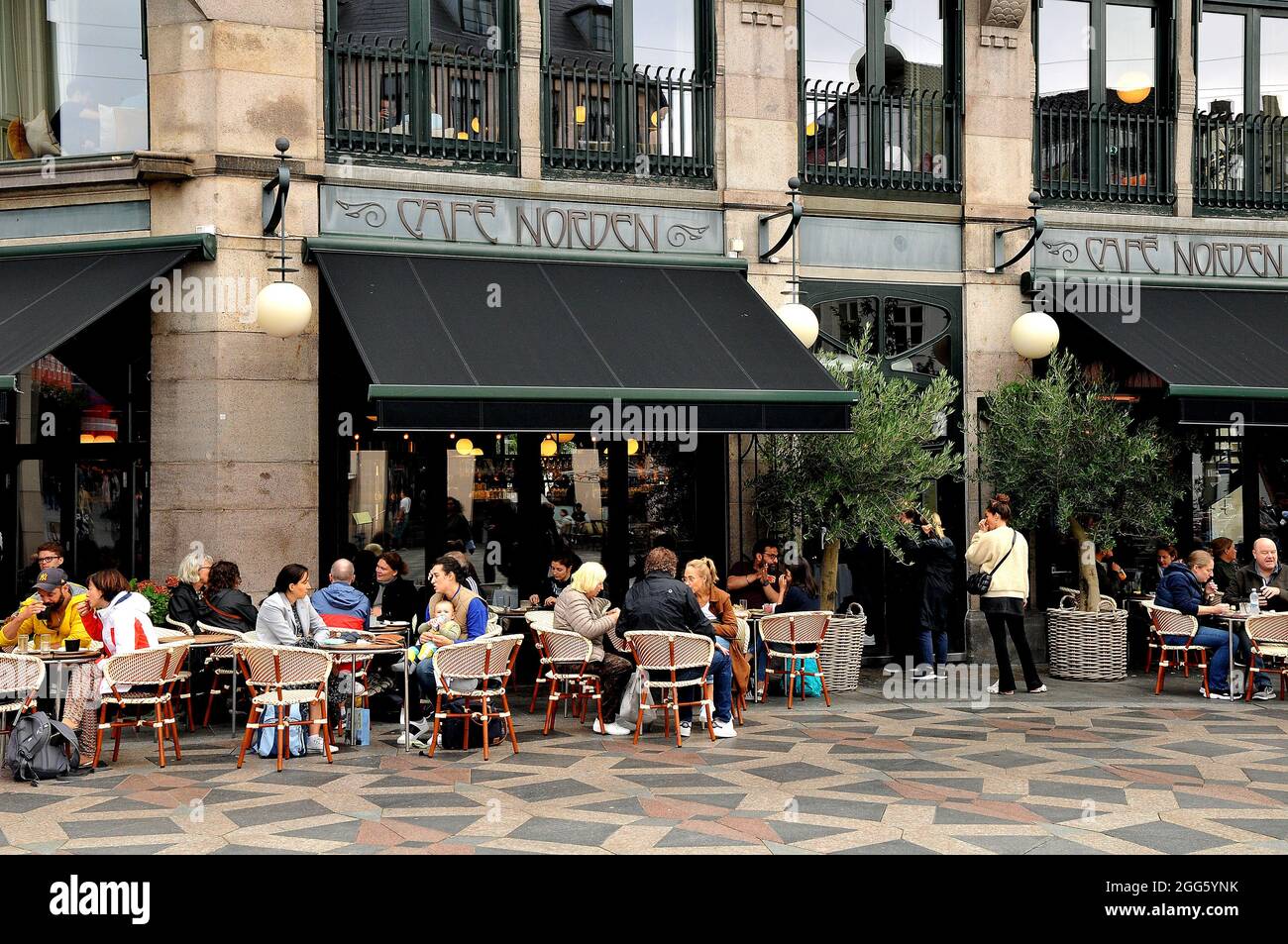 Copenhagen, Denmark., 29 August 2021, /Cafe customers enjoy outdoor