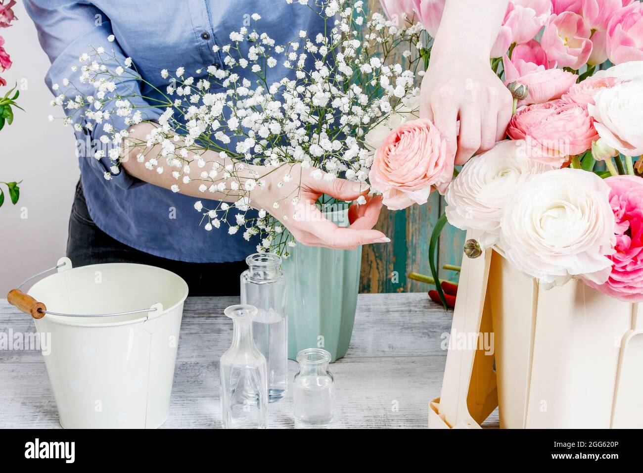 Work Sorting Roses Florist workplace: woman arranging a bouquet with roses, matthiolas ...