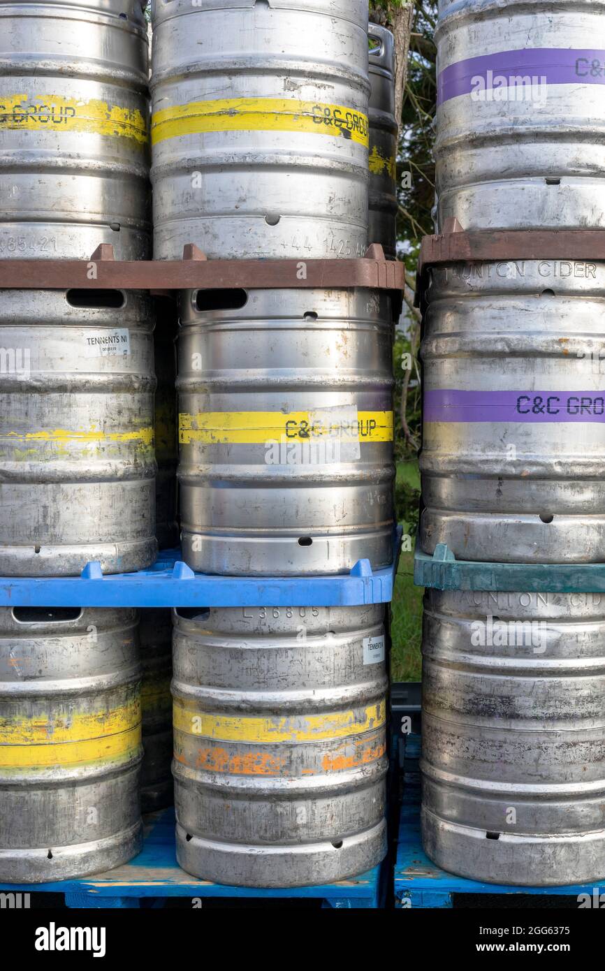 Aluminium beer, lager and cider barrels stacked  outside a pub, Scotland Stock Photo